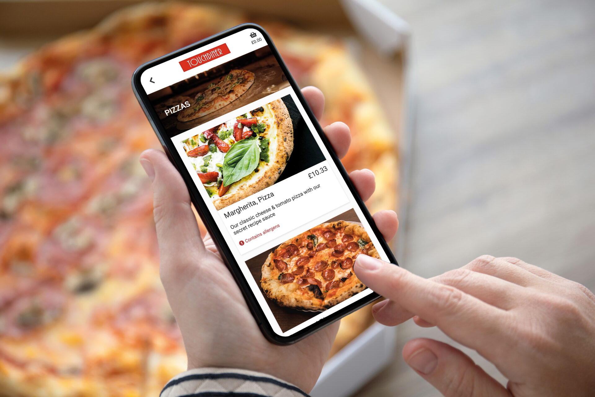 Person ordering pizza via TouchTakeaway